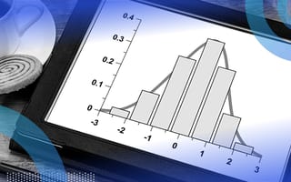 histogram on a tablet next to coffee