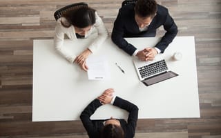 Hr managers interviewing female job applicant, recruiters listen to candidate answering questions at hiring negotiations, recruiting and staffing, making first impression concept, top view from above