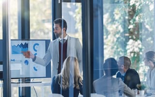 Team of executives looks at finance data.