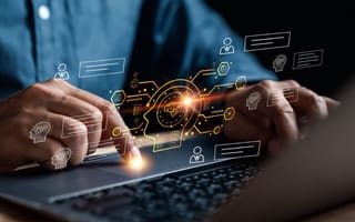 15 AI Companies in Australia to Know A person interact with AI on a laptop.