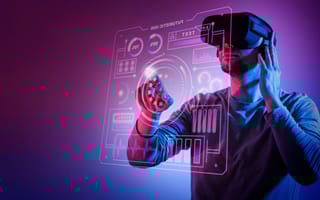 A person with a VR headset interacting with a hologram.