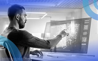 data scientist analyzing a cluster of data points on computer