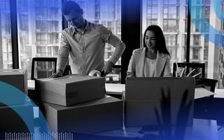 Happy employees moving into a new office.