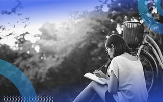 Person journaling charting life stats