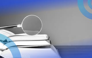 magnifying glass on an open book