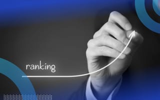 A close-up of a person drawing an arrow labeled “ranking” sloping upward.