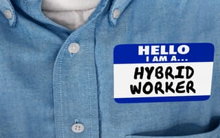 a person wearing a name-tag that says 'hybrid worker' on it.