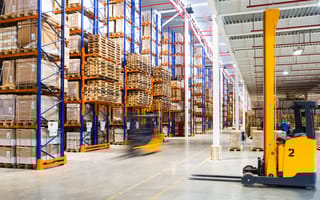 Modern warehouse with forklifts.