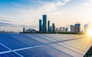 Solar panels near sky scrappers.