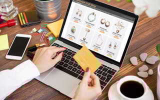 A person buys jewelry through a digital marketplace.
