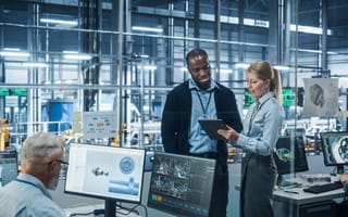 Engineers analyze blueprints.