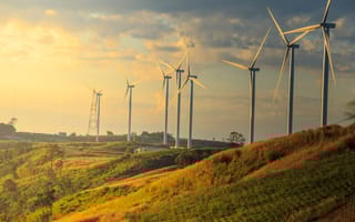 Wind turbines in a grassy field.