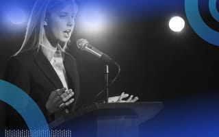 A woman giving a speech at a podium.
