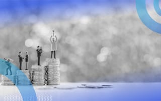 Four stacks of coins getting progressively taller with a miniature man working hard, shaking hands with another businessman, holding a bag of money and finally holding a trophy above his head.