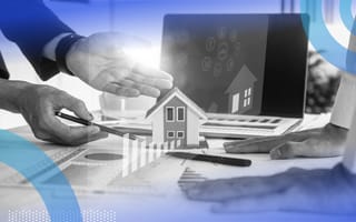 A close up of two people looking at documents and a laptop with a digital house overlaid