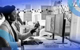 hardware designer holding a device next to laptop