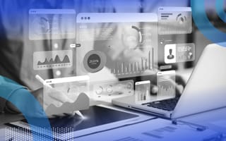 An analyst uses a laptop with hovering dashboard icons