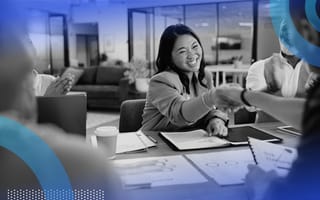 3 Buyer Trends That Will Help You Close More Deals in 2024 salesperson closing a business deal with handshake