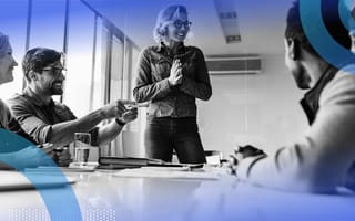 Startup executive talking to team at table