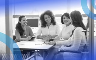 A group of women socializing at the office.