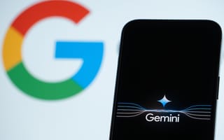 A smartphone with the word 'Gemini' on its screen, with the Google logo in the background.