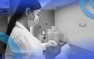 A scientist working with CRISPR technology at a bench.