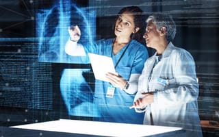 Doctors analyze an x-ray.
