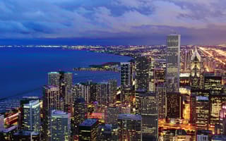Chicago skyline at night looking over Lake Michigan
