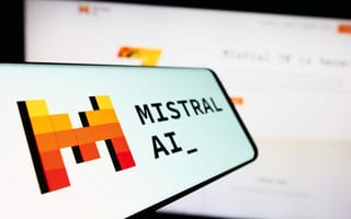A photograph of a smartphone with the Mistral AI logo on it.