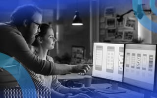 A man and woman UX architect work at a computer terminal on a mobile app