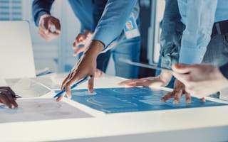 Engineers gathered around a conference table.