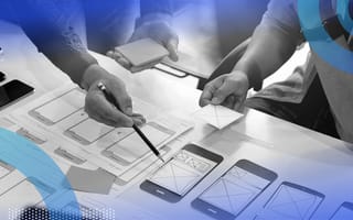 UX designers designing mobile app blueprint
