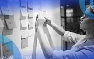 Task Flow and User Flow Explained Designer charting the task and user flow on a board