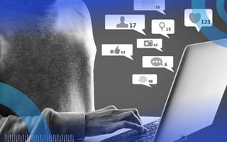 hacker on a laptop browsing social media with social media icons overlay