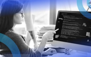 Developer writing HTML code on computer