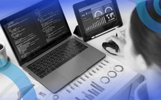 Sales leader calculating revenue on laptop