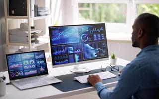 5 Data Companies in Brazil to Know Data analyst oversees various data visualizations on computer.