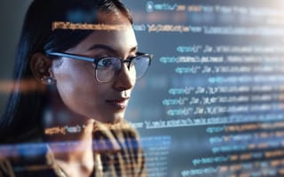 Software engineer looks at code.