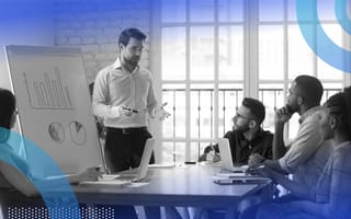 A manager is making a presentation to a combined sales and marketing team.