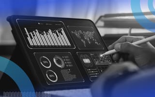 Data scientist working with graphs on tablet