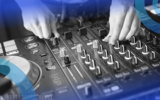 A close-up of someone tuning a DJ board.