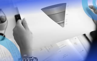 A salesperson is holding a sheet of paper depicting a sales funnel.