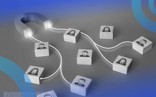 A magnet with strings coming out of it connected to blocks with tiny people on them.