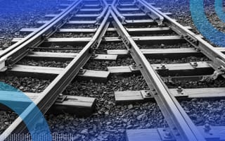 Two merging train tracks representing sql merging two tables