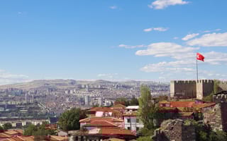 Ankara Castle on a beautiful summer day with Turkish flag flying at top of castle