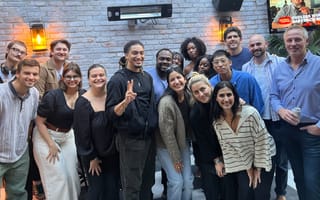 Crafty team members posing for a group photo on an outdoor restaurant patio.