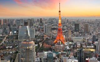 Tokyo at sunrise with a focus on the Red Tokyo Tower.