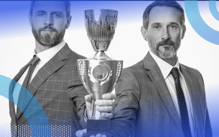 Two businessmen hold a trophy