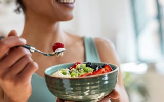 Person eating bowl of food
