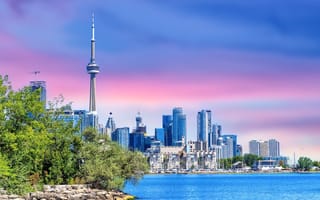 A view of the Toronto, Ontario skyline taken next to the water.